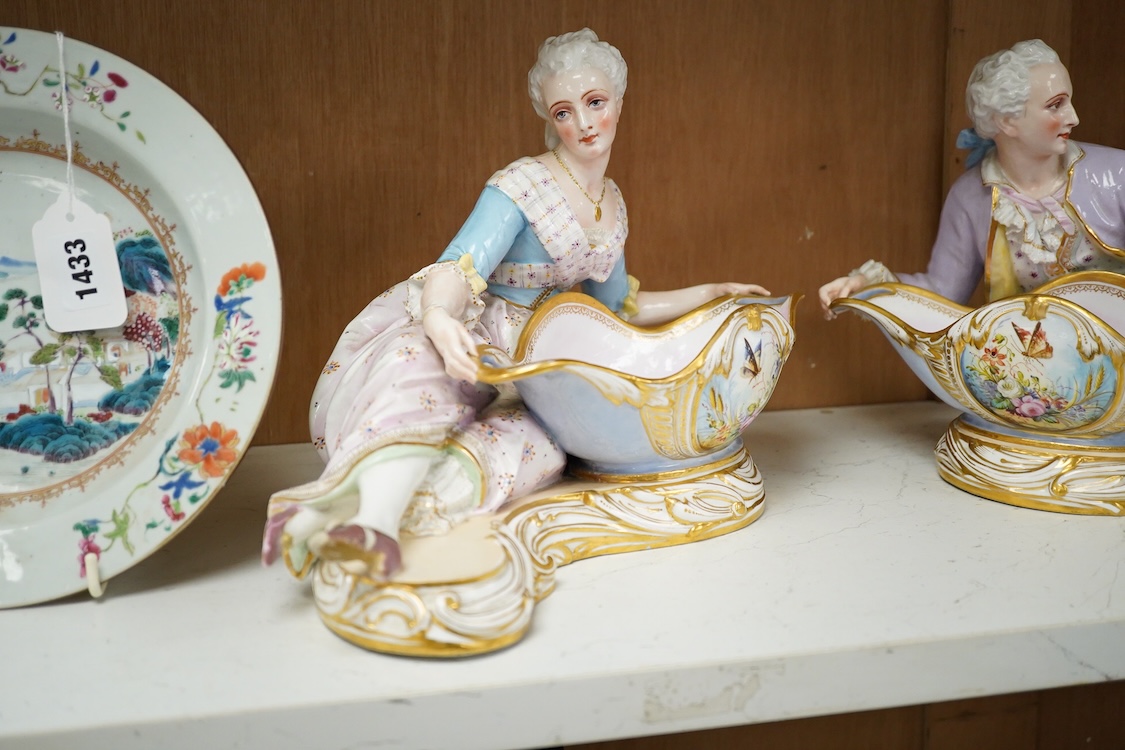 A pair of French porcelain figural sweet meat dishes, late 19th century, 34.5cm